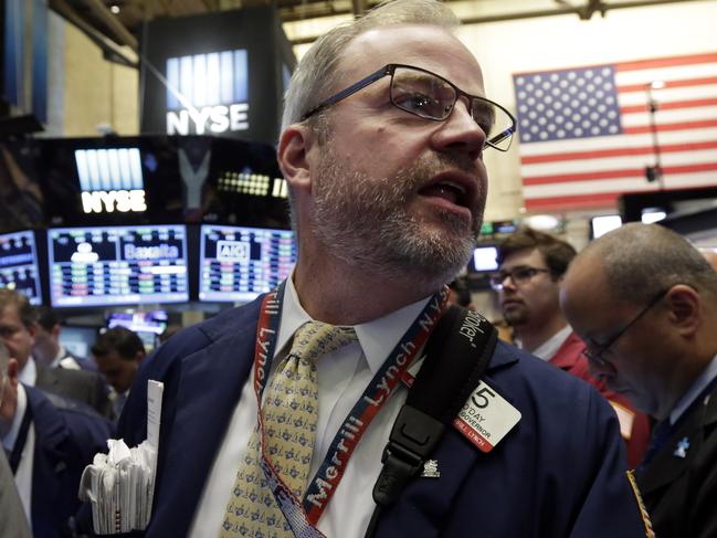 Trader David O'Day works on the floor of the New York Stock Exchange Thursday, Aug. 6, 2015. U.S. stocks edged modestly lower in early trading as investors look over the latest deal and earnings news. Sliding oil prices pulled stocks in energy companies lower. (AP Photo/Richard Drew)