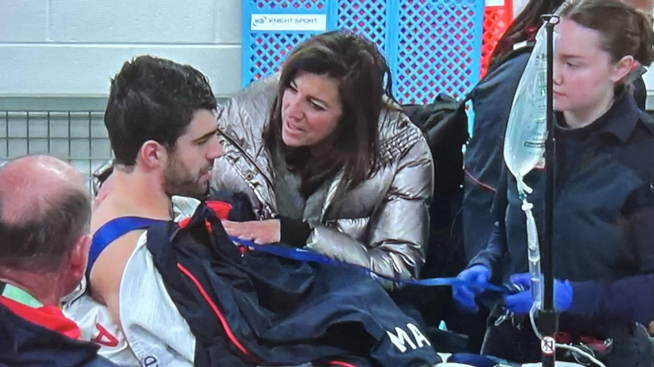 Christian Petracca on his way to hospital after an accidental knee in the ribs.