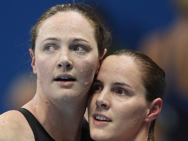 AustraliaÕs Cate Campbell with sister Bronte after finishing sixth and fourth in the WomenÕs 100m Freestyle Final on day six of the swimmingat the Rio 2016 Olympic Games. Picture. Brett Costello