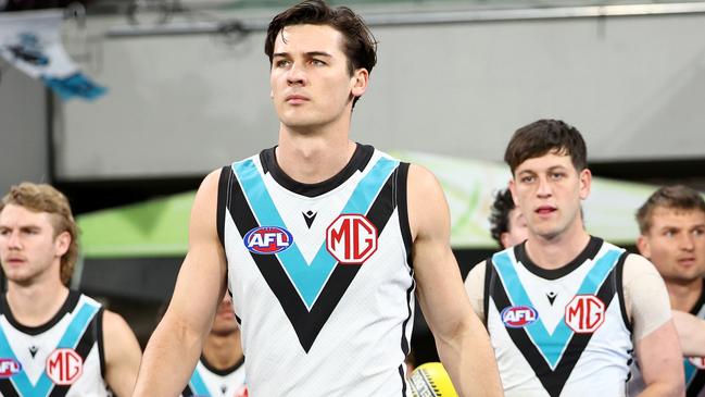 MELBOURNE, AUSTRALIA - AUGUST 10: Connor Rozee of the Power leads his team onto the field during the round 22 AFL match between Melbourne Demons and Port Adelaide Power at Melbourne Cricket Ground, on August 10, 2024, in Melbourne, Australia. (Photo by Josh Chadwick/Getty Images)