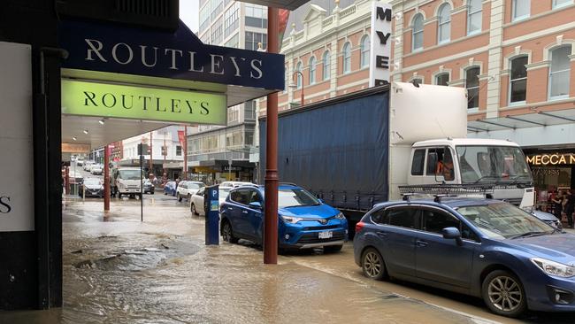 Flooding in Murray Street outside Routleys in Hobart's CBD. Picture: Joanne Young