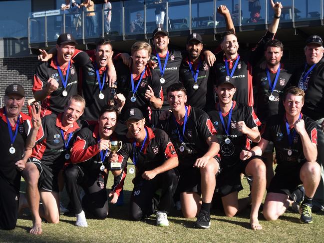 South Caulfield players and officials show off the premiership cup. Picture: Ron Weil