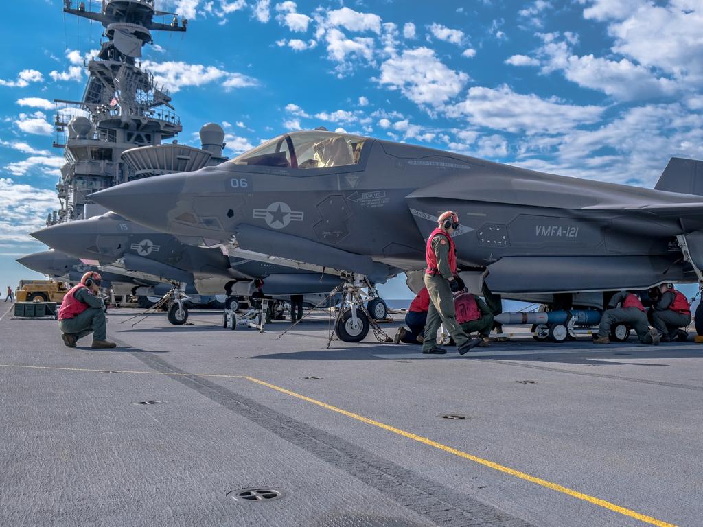 U.S. Marine Corps Aviation Ordnance Technicians with Marine Medium Tiltrotor Squadron 265 (Reinforced), 31st Marine Expeditionary Unit (MEU), load munitions onto an F-35B Lightning II aboard the USS America (LHA 6), during Talisman Sabre on July 17, 2021. The F-35B Lightning IIÃ¢â&#130;¬â&#132;¢s fifth generation strike fighter capabilities bring more lethality and flexibility to combat commanders than any other aircraft platform. Australian and U.S. forces combine biannually for Talisman Sabre, a month-long multi-domain exercise that strengthens allied and partner capabilities to respond to the full range of Indo-Pacific security concerns. The 31st MEU is operating aboard ships of America Expeditionary Strike Group in the 7th fleet area of operations to enhance interoperability with allies and partners and serve as a ready response force to defend peace and stability in the Indo-Pacific region. (U.S. Marine Corps photo by Staff Sgt. John Tetrault)