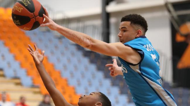 Casey Cavaliers player Jai Kamande blocks North Adelaide Rockets player Kobe Brunner at the Basketball Australia Under-14 Club Championships. Picture: Basketball Australia