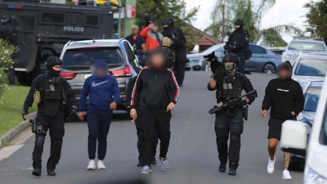 A baton, slingshot and mask were seized from a car nearby.