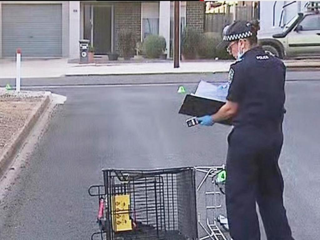 Police examine a shopping trolley as a 34-year-old man is clinging to life after a brutal assault at Murray Bridge. Picture: 7NEWS Adelaide