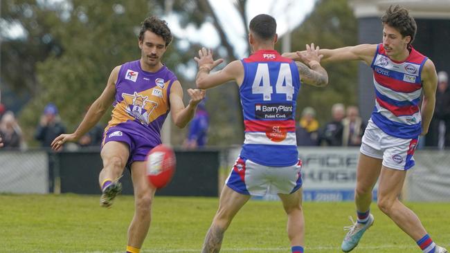 Ethan Taylor takes a kick for Altona. Picture: Valeriu Campan