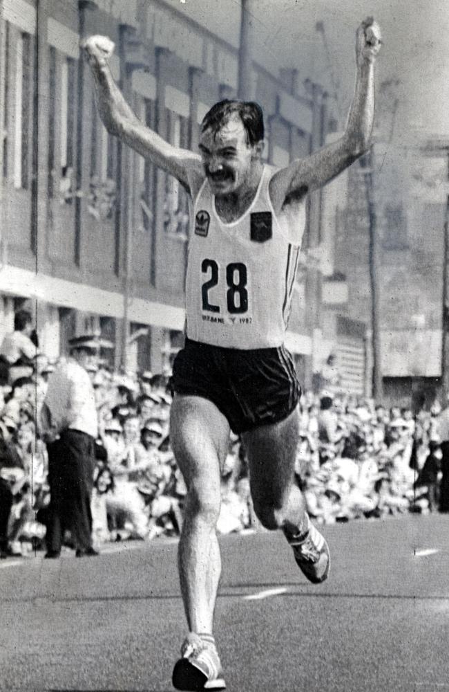 Australian Robert de Castella crosses the finish line in jubilation to win the 1982 Commonwealth Games marathon in South Brisbane. He was applauded by a huge and enthusiastic crowd.