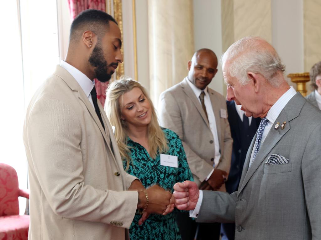 Tyler West and King Charles III share a fist bump during a reception for the winners of The 20th Prince’s Trust Awards at Buckingham Palace. Picture: Getty Images