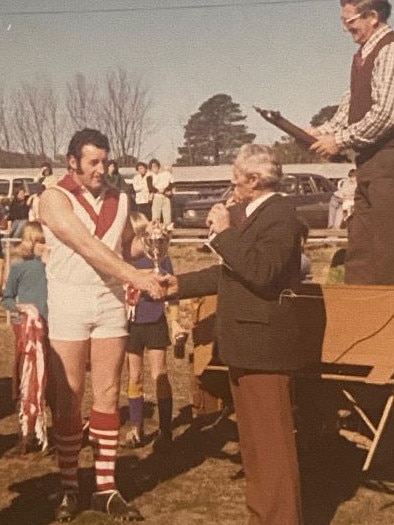 Benambra's Barry Pendergast accepting one of his nine Omeo and District Football League best and fairest awards in the 1970s. Picture: Supplied