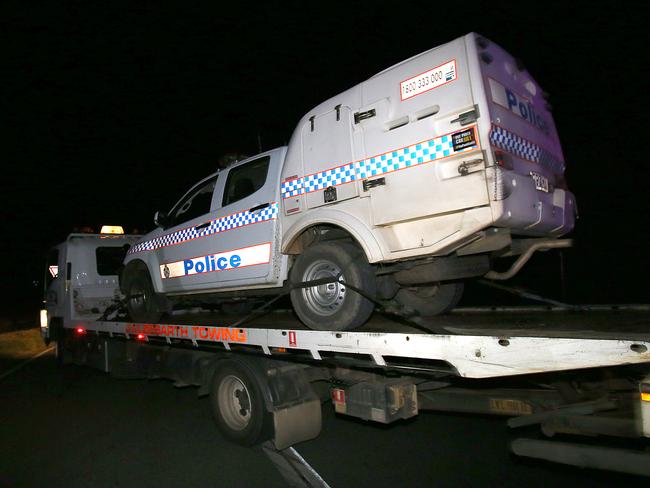 The police vehicle involved in the incident is removed from the scene late last night. Picture: Marc Robertson