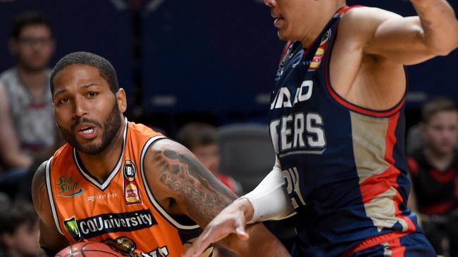 Taipans DJ Newbill with 36ers Harry Jacob Wiley. Photo — Naomi Jellicoe.