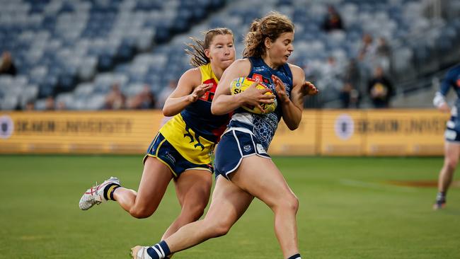 GEELONG, AUSTRALIA - NOVEMBER 01: Nina Morrison of the Cats is tackled by Sarah Goodwin of the Crows during the 2024 AFLW Round 10 match between the Geelong Cats and Kuwarna (Adelaide Crows) at GMHBA Stadium on November 01, 2024 in Geelong, Australia. (Photo by Dylan Burns/AFL Photos via Getty Images)