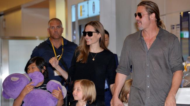 Angelina Jolie and Brad Pitt at Haneda airport in Tokyo in 2013 with their children. Picture: AFP