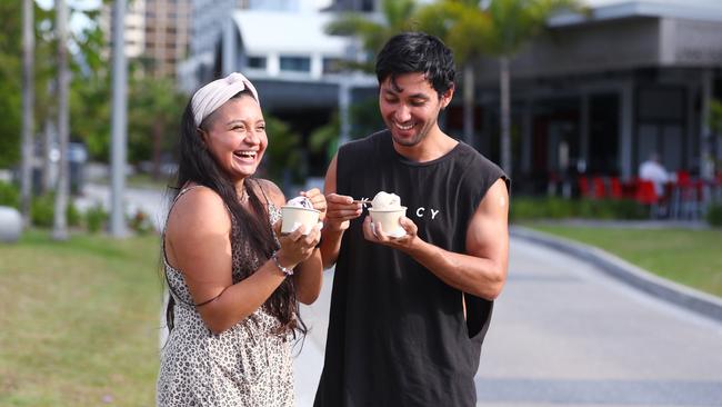 Pamela Sepulveva and Rogers Munoz of Parramatta Park enjoy some ice cream and a stroll along the Cairns Esplanade Dining precinct. Picture: Brendan Radke