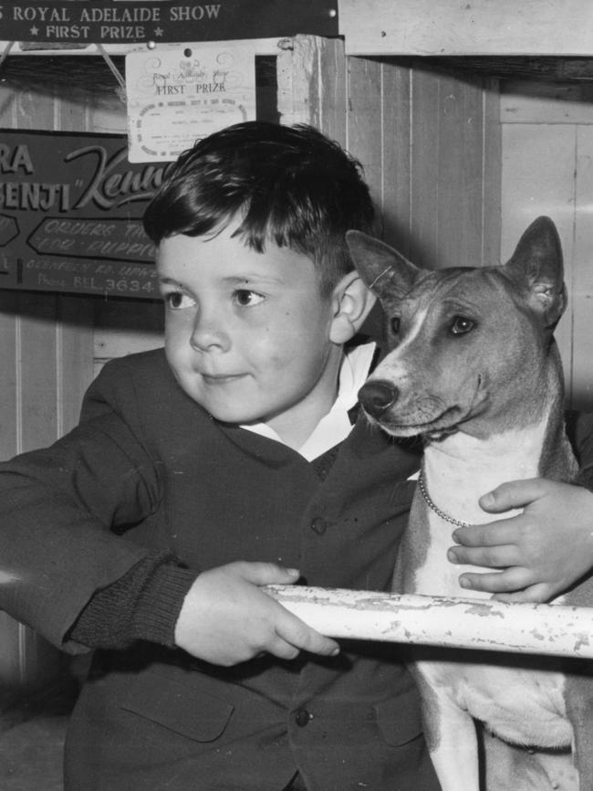 1965 — Adrian Barker, 6, of Victoria with family dog Jessica, a Basengi.