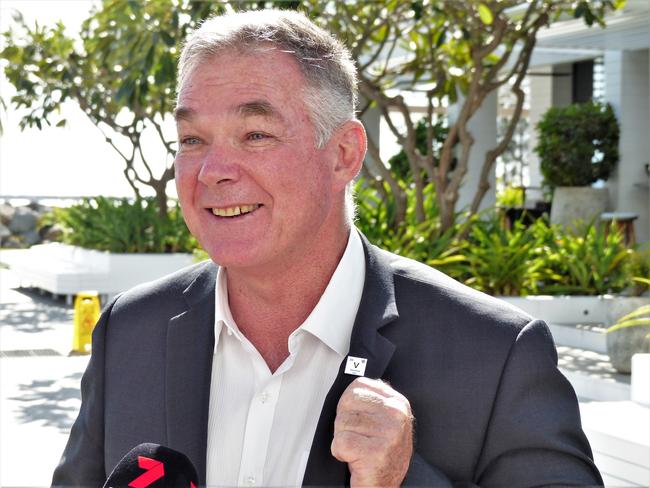 State Resources Ministers and Townsville MP Scott Stewart shows of a 'vanadium' lapel pin while speaking in Townsville on Tuesday. Picture: Blair Jackson.