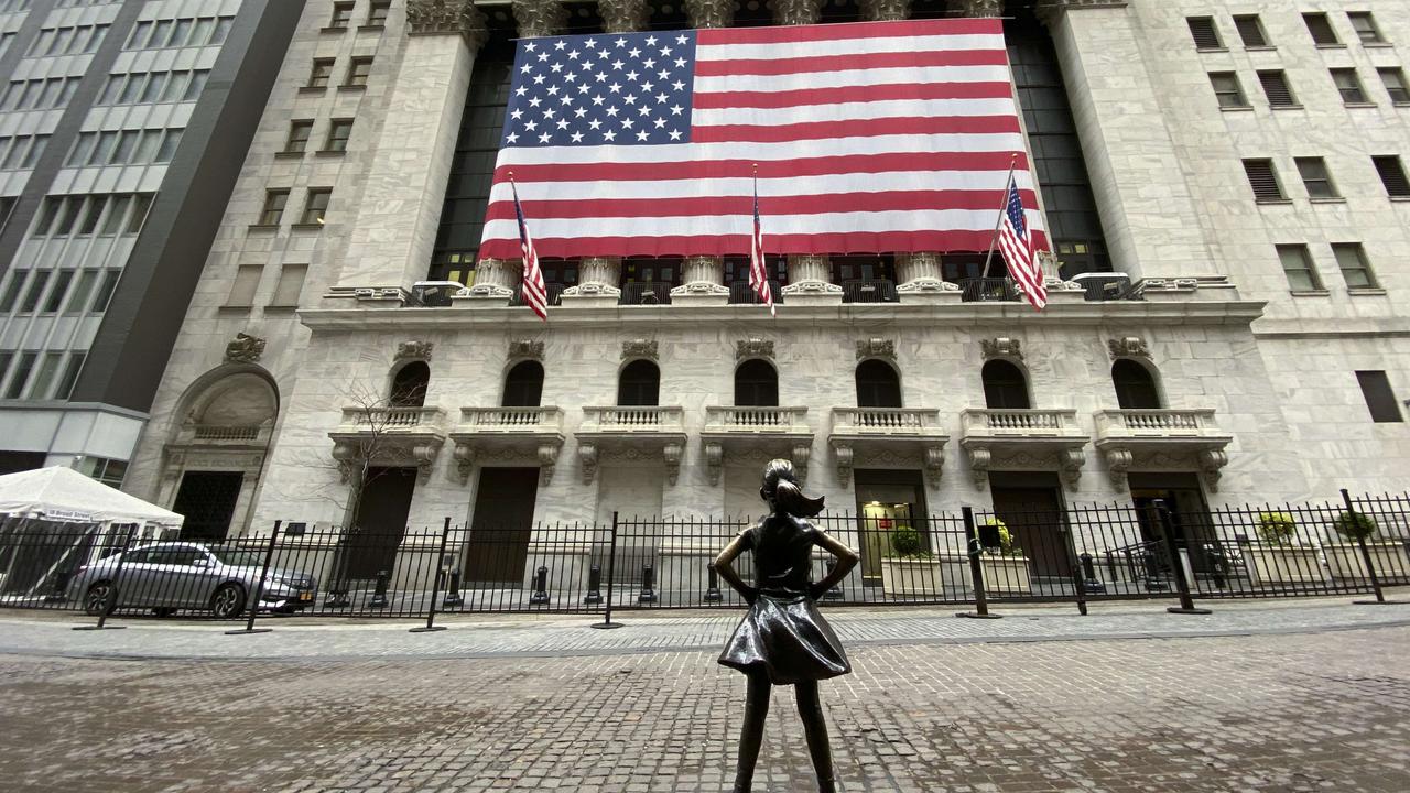 Flags fly at full staff outside the NYSE on April 09, 2020 in New York City. Picture: Kena Betancur/Getty Images/AFP.=