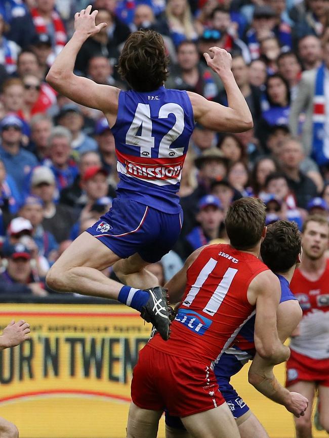 Liam Picken flies high for a spectacular mark. Picture: Wayne Ludbey