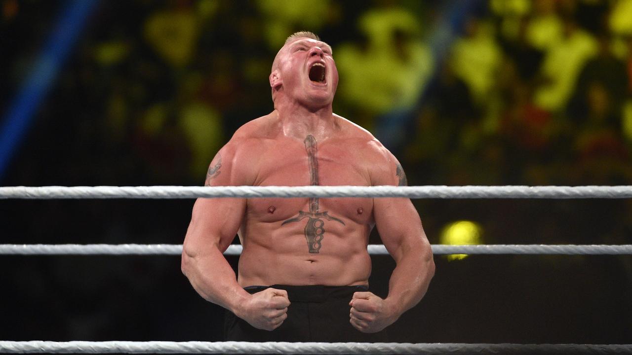 Brock Lesnar celebrates after winning the WWE Universal Championship match as part of as part of the World Wrestling Entertainment (WWE) Crown Jewel pay-per-view at the King Saud University Stadium in Riyadh on November 2, 2018. (Photo by AFP)