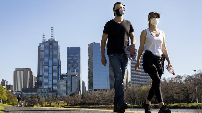 Locals enjoying the warmer weather on the Yarra trail on Monday during their hour of daily exercise in Melbourne. Picture: NCA NewsWire / David Geraghty