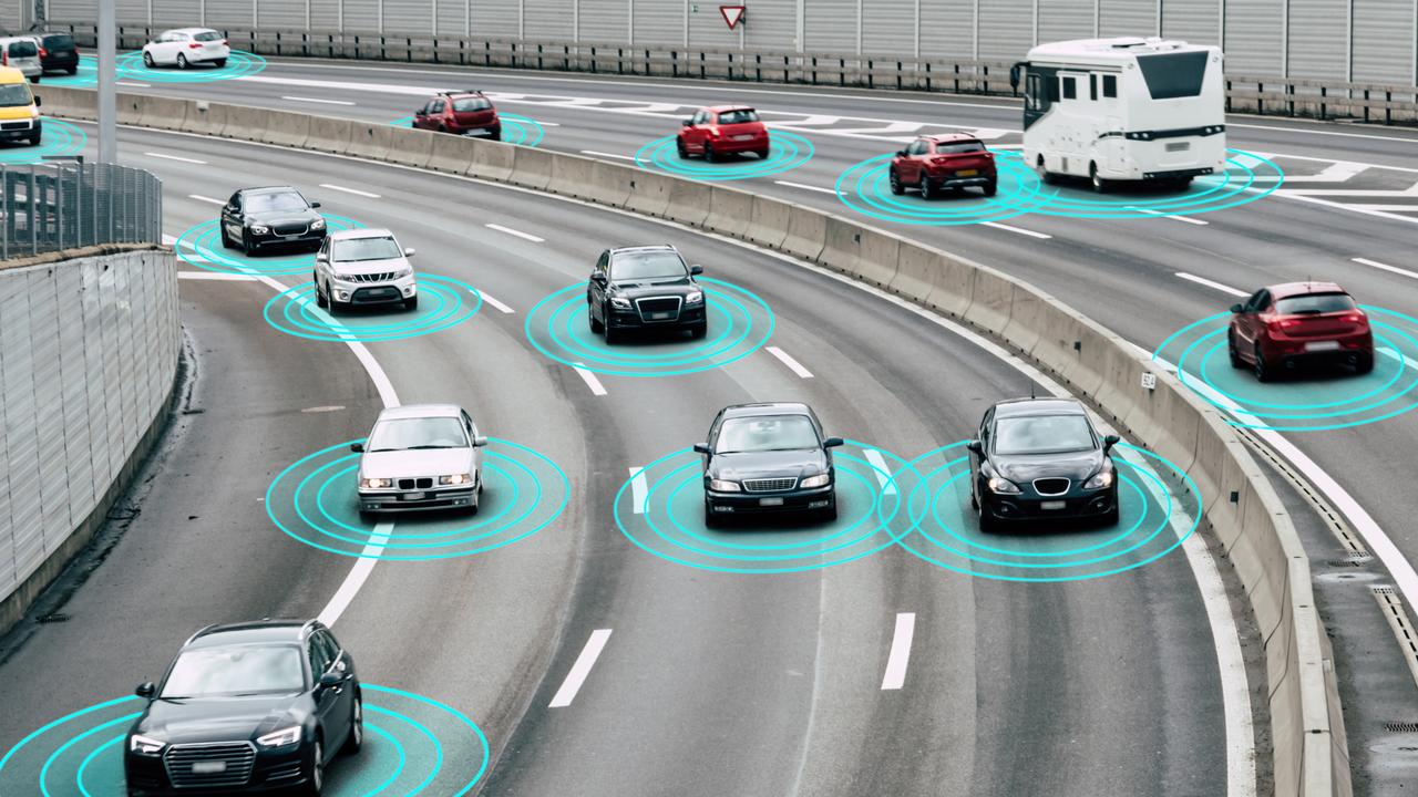 Illustration and photo of autonomous, self-driving cars driving on a highway. The cars are connected through wireless technology and artificial intelligence which enables them to drive on the road safely.