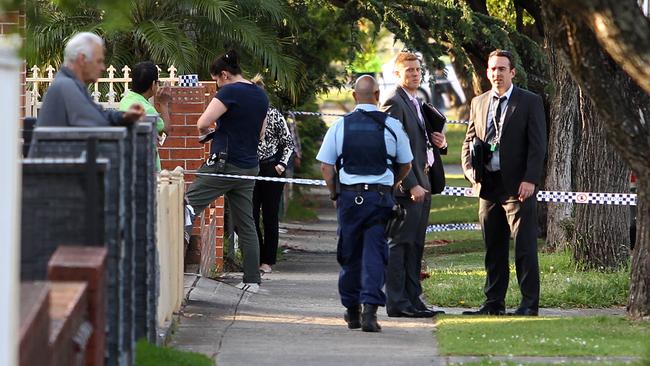 Police question residents of St. Clair Street in Belmore after a possible shooting or stabbing on Redman Lane in Belmore NSW. Picture : Richard Dobson