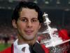 FILE - In this May 1994 file photo, Ryan Giggs of Manchester United holds the FA Cup. Manchester United great Ryan Giggs has ended his playing career after a club-record 963 appearances. Giggs made the announcement in an open letter on United's website on Monday, May 19, 2014, the day he was hired as assistant manager to Louis van Gaal. (AP Photo/PA, John Stillwell, File) UNITED KINGDOM OUT NO SALES NO ARCHIVE