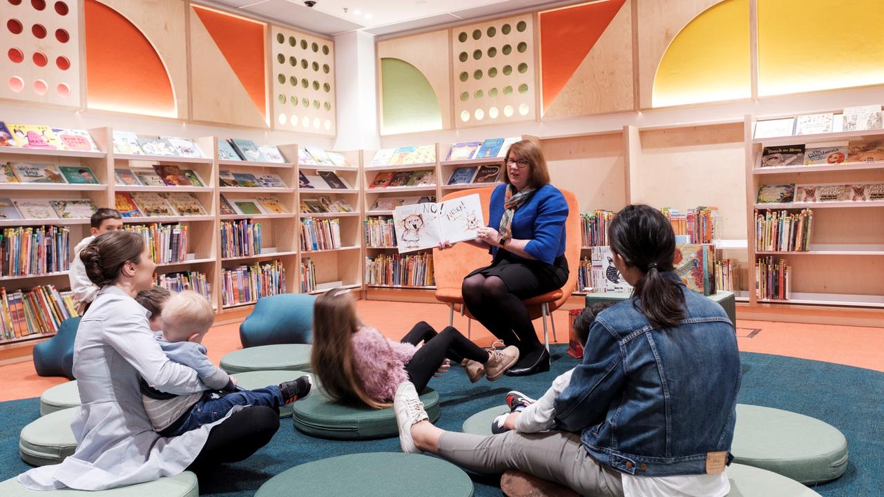 Parramatta Lord Mayor Donna Davis reads to some youngsters and their parents in the library, which boasts 65,000 books. Picture: Mike Bell