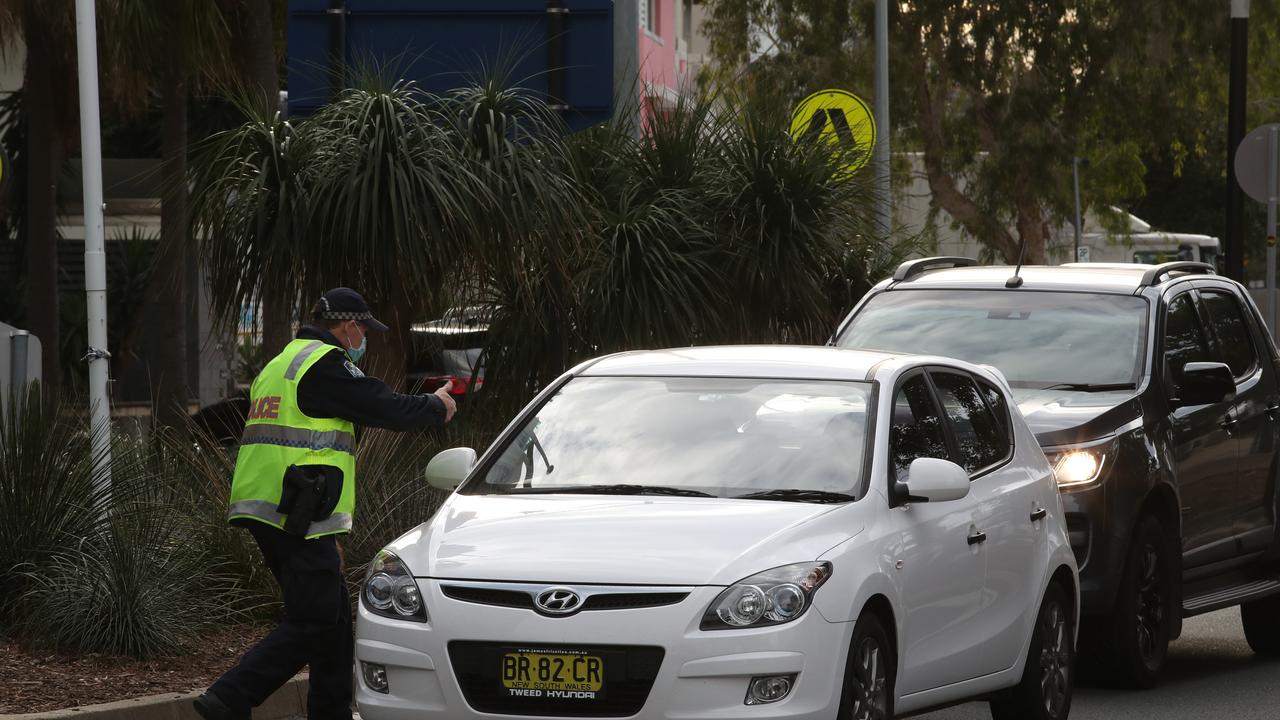 The hard border and long Queues return to the Qld NSW border on the Gold Coast. People getting the thumbs up or turned away in Griffith St Coolangatta. Picture: Glenn Hampson.