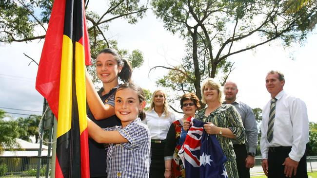 Tallebudgera State School is going to use money from a donation it has received to increase knowledge and respect for Aboriginal and Torres Straight Islander cultures by buying two new flag poles and flags so that the Australian, Aboriginal and Torres Straight Islander flags can hang side-by-side. Photo: (L-R) Tyler Hart (12), Charlie Hart (8), Sarah Clasen, Councillor Daphne McDonald, Principal Toni Robinson, Stuart Breen and Darren Newton.