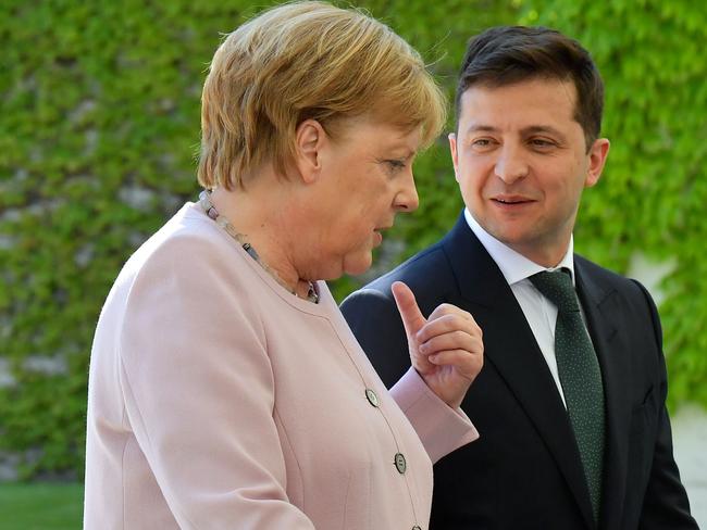 German Chancellor Angela Merkel on the day of her first shaking episode on June 18 in Berlin. She is seen here with new Ukrainian President Volodymyr Zelensky. Picture: AFP