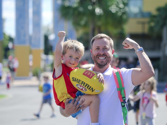 Ramon Palomar takes his son Freddy (3) to his first AFL game as the Gold Coast Swans take on the Sydney Swans at People First Stadium, Carrara. Picture: Glen Campbell