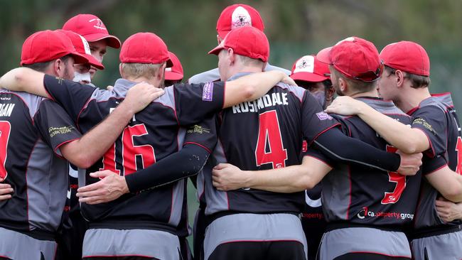 West Coburg captain Michael Rosendale talks to his players.