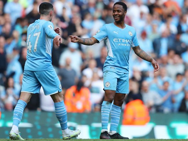 MANCHESTER, ENGLAND - MAY 08: Raheem Sterling of Manchester City celebrates scoring their side's fifth goal with teammate Phil Foden during the Premier League match between Manchester City and Newcastle United at Etihad Stadium on May 08, 2022 in Manchester, England. (Photo by Alex Livesey/Getty Images)