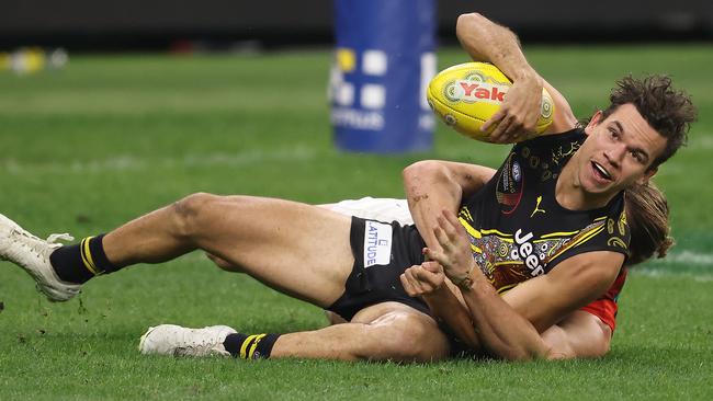 Mason Redman brings down Richmond’s Daniel Rioli.