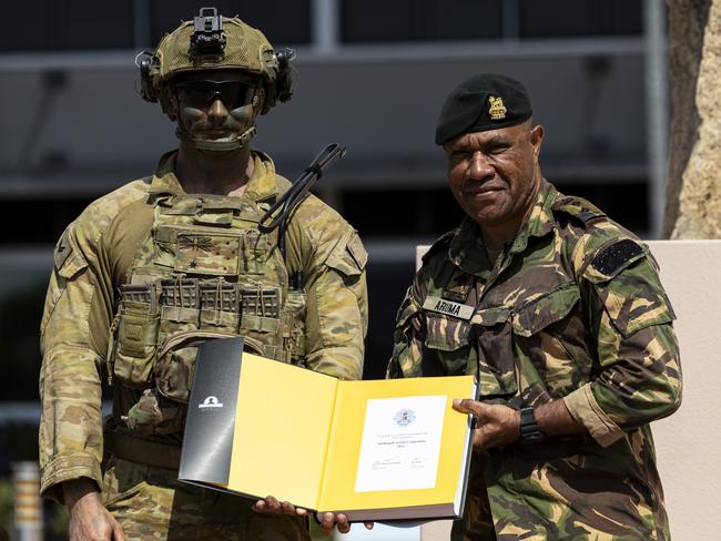 Australian Army soldier Corporal Jarrod Webbers from 1st Battalion, Royal Australian Regiment accepts the award for "Overall Winner" at the completion of the annual 3rd Brigade Military Skills competition at Lavarack Barracks, Townsville. PHOTO: CPL Jack Pearce