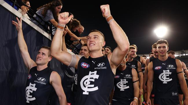 A jubilant Patrick Cripps leads his team off the MCG. Picture: Michael Klein