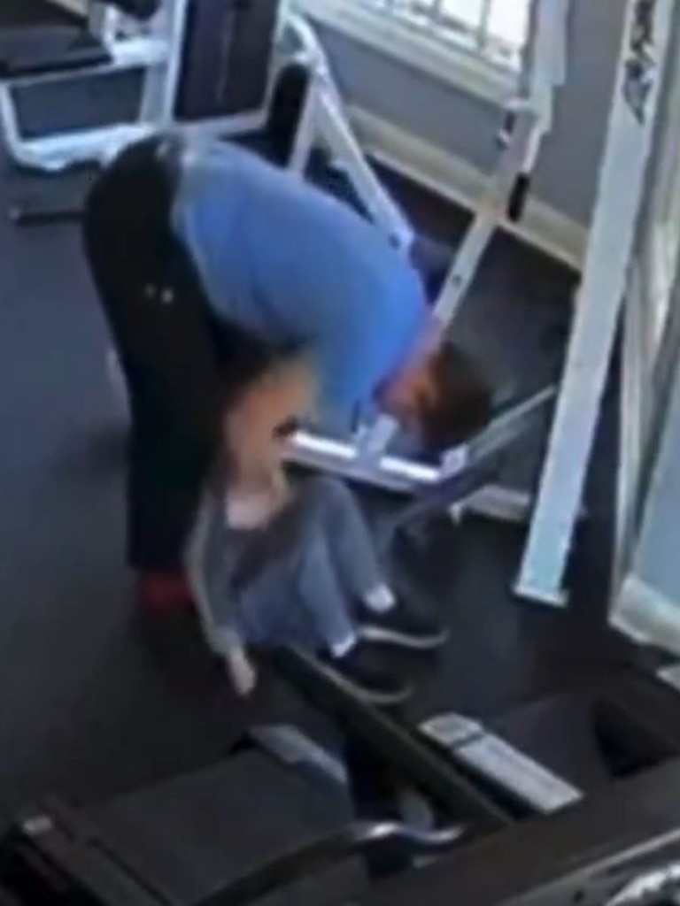 The boy was running on the treadmill for several minutes before his father appeared and stood nearby.