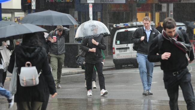 People on King William Street during last week’s wet weather. Picture: Michael Marschall