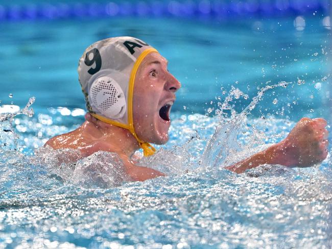 Australia's #09 Matthew Byrnes celebrates after scoring in the men's water polo preliminary round group B match between Australia and Serbia during the Paris 2024 Olympic Games at the Aquatics Centre in Saint-Denis, north of Paris, on July 30, 2024. (Photo by Andreas SOLARO / AFP)