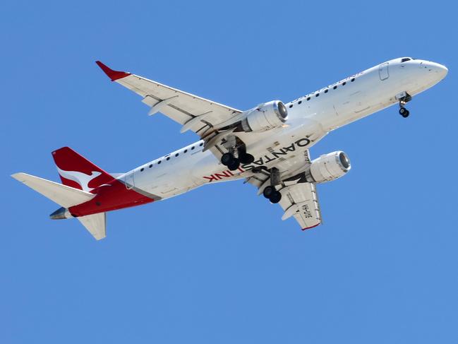 BRISBANE, AUSTRALIA - NewsWire Photos SEPTEMBER 30, 2024: A Qantas plane prepares to land in Brisbane. Hundreds of Qantas workers went on strike today demanding higher wages. Picture: NewsWire/Tertius Pickard