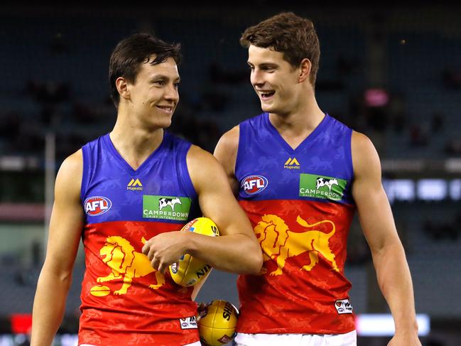 MELBOURNE, AUSTRALIA - APRIL 09: Debutantes and former North Ballarat Rebels teammates, Hugh McCluggage (left) and Jarrod Berry of the Lions chat after their AFL debuts during the 2017 AFL round 03 match between the St Kilda Saints and the Brisbane Lions at Etihad Stadium on April 09, 2017 in Melbourne, Australia. (Photo by Adam Trafford/AFL Media/Getty Images)