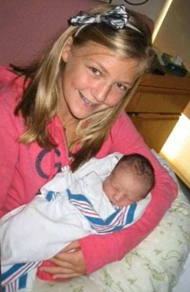 A young Gabby with an infant, possibly one of her half siblings. Picture: Moloney Funeral Home.