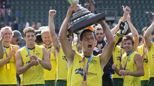 Jamie Dwyer lifts the World Cup.