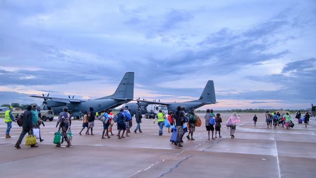 The Royal Australian Air Force assists residents from the Kalkarindji area being evacuated during major flooding in the Northern Territory.