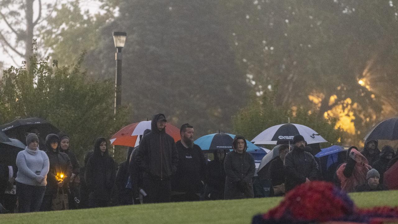 Rain failed to deter residents from paying their respects at the Mothers' Memorial for the Anzac Day Toowoomba Dawn Service, Tuesday, April 25, 2023. Picture: Kevin Farmer