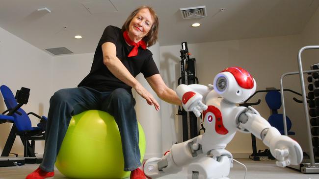 Mark Moran Vaucluse resident Angie Dalrymple doing Tai Chi with the NAO robots. Pictures: Phil Rogers.