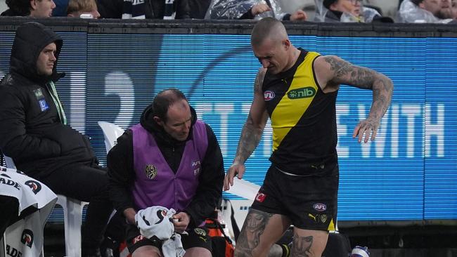 MELBOURNE, AUSTRALIA - JUNE 30: Dustin Martin of the Tigers receives medical attention on his back during the round 16 AFL match between Richmond Tigers and Carlton Blues at Melbourne Cricket Ground, on June 30, 2024, in Melbourne, Australia. (Photo by Daniel Pockett/Getty Images)