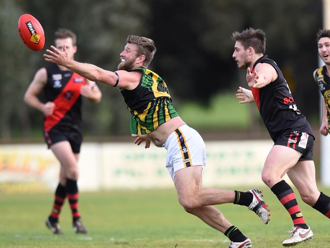 Dromana champion Adam Hunter reaches for the ball. Picture: Jason Sammon.